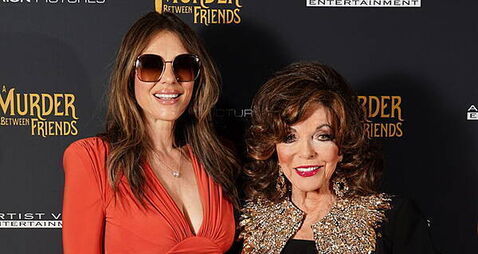 Joan Collins reunites with Elizabeth Hurley on red carpet