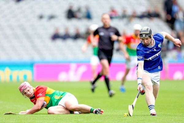 Laois's Cody Comerford leaves this Carlow forward floundering in his wake Photo: Paul Dargan Laois's Cody Comerford leaves this Carlow forward floundering in his wake Photo: Paul Dargan