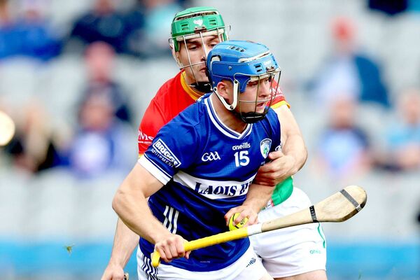 Laois's Tomas Keyes heads for goal despite the best efforts of the Carlow defender Photo: Paul Dargan Laois's Tomas Keyes heads for goal despite the best efforts of the Carlow defender Photo: Paul Dargan