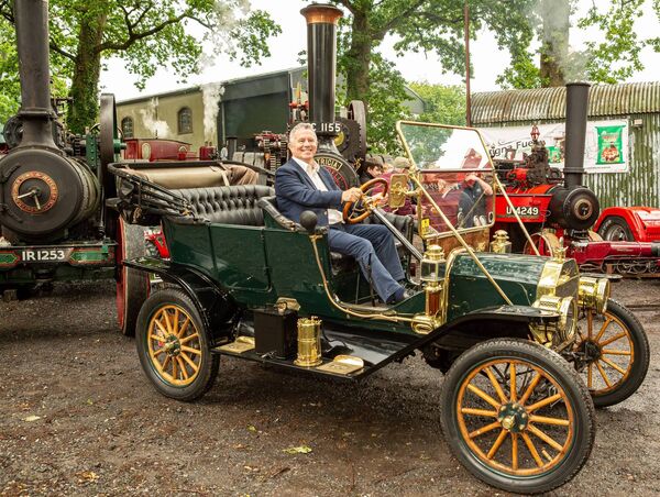 Seán Fleming TD gets to grips with a vintage car at the launch of the National Steam Rally 2026. Seán Fleming TD gets to grips with a vintage car at the launch of the National Steam Rally 2026.