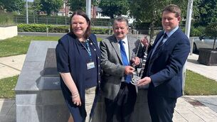 <p>Angela McEvoy, Laois Co Council official; Cllr Ollie Clooney, the newly elected Cathaoirleach of Borris-in-Ossory/Mountmellick Municipal District being presented with his chain of office from the outgoing Cathaoirleach Conor Bergin</p>