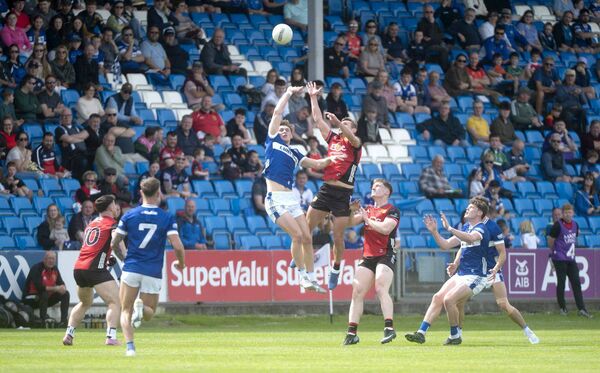 Ciaran Burke (Laois) and Caolan Mooney (Down) compete for this ball in the Tailteann Cup quarter-final Photo Denis Byrne Ciaran Burke (Laois) and Caolan Mooney (Down) compete for this ball in the Tailteann Cup quarter-final Photo Denis Byrne