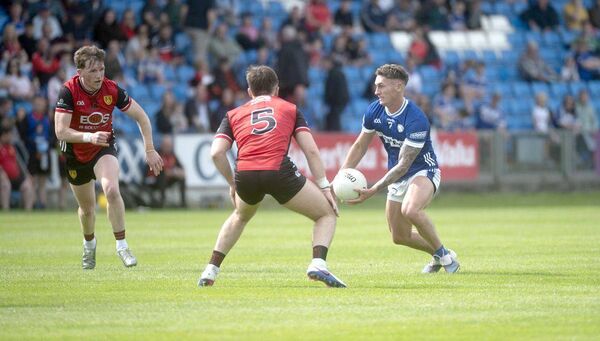 Padraig Kirwan (Laois) looks for a way past Miceál Rooney (Down) on Saturday Photo Denis Byrne Padraig Kirwan (Laois) looks for a way past Miceál Rooney (Down) on Saturday Photo Denis Byrne