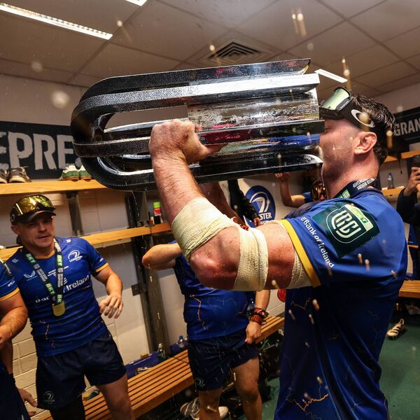 Gary Ringrose watches on as James Ryan gulps down a mix of beer and champagne from the URC trophy as the celebrations get started in the Leinster dressing room. Photo: INPHO/Ben Brady Gary Ringrose watches on as James Ryan gulps down a mix of beer and champagne from the URC trophy as the celebrations get started in the Leinster dressing room. Photo: INPHO/Ben Brady