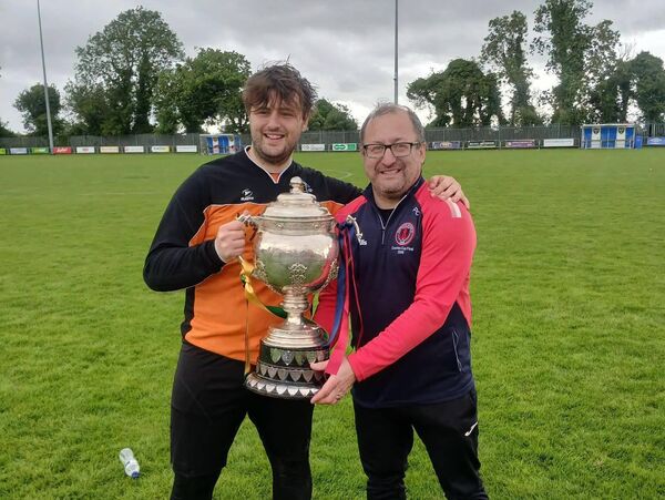 Clonaslee United manager Paul Culleton with his son and goalkeeper, Cian. Photo: Clonaslee United. Clonaslee United manager Paul Culleton with his son and goalkeeper, Cian. Photo: Clonaslee United.