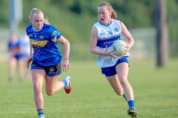 Laois's Kate Dowling races clear of this Tipperary defender in their U/16 All-Ireland semi-final 	 Photo: Paul Dargan
