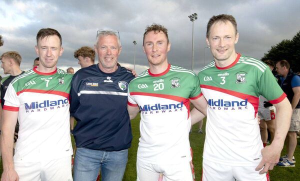 Rathdowney/Errill's Jimmy Corrigan, PJ Rafter, Darren King and Brian Campion after the ACHL Division 2 final Photo: Denis Byrne