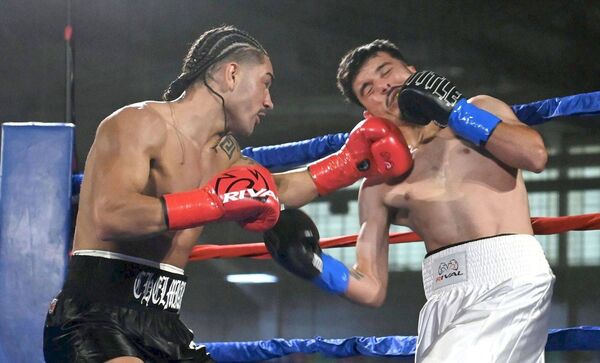 Eoghan Chelmiah lands a cracker of a shot on boxer Jesus Antonio Rios Castro's chin Eoghan Chelmiah lands a cracker of a shot on boxer Jesus Antonio Rios Castro's chin