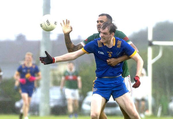 Graiguecullen's Aaron Forbes keeps a tight rein on Fergal Scully (Annanough) in the ACFL Division 4 final Photo: Denis Byrne Graiguecullen's Aaron Forbes keeps a tight rein on Fergal Scully (Annanough) in the ACFL Division 4 final Photo: Denis Byrne
