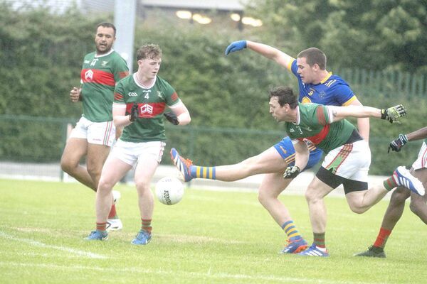 Cormac Deegan (Annanough) gets his shot away despite the pressure being put on him by the Graiguecullen defence Photo: Denis Byrne Cormac Deegan (Annanough) gets his shot away despite the pressure being put on him by the Graiguecullen defence Photo: Denis Byrne