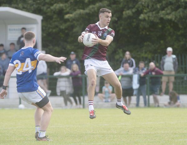 Ronan Coffey (Portarlington) gathers this ball to set up an attack on the O'Dempsey's goal Photo: Denis Byrne Ronan Coffey (Portarlington) gathers this ball to set up an attack on the O'Dempsey's goal Photo: Denis Byrne