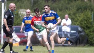 <p>Pat Maher (O'Dempsey's) goes on the attack with Patrick Hyland (Clonaslee/St Manmans) giving chase as referee JJ Kirby keeps a close eye on the action Photo: Denis Byrne</p> <p>Pat Maher (O'Dempsey's) goes on the attack with Patrick Hyland (Clonaslee/St Manmans) giving chase as referee JJ Kirby keeps a close eye on the action Photo: Denis Byrne</p>