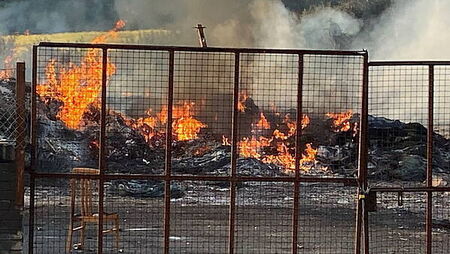 Bonfire topped with replica mosque set alight before bid to remove hate display