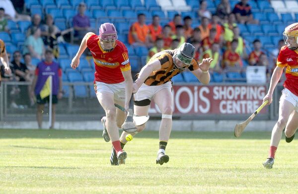 Justin Duggan (Harps) and Cathal Cuddy (Camross) compete for this sliotar Photo: Denis Byrne Justin Duggan (Harps) and Cathal Cuddy (Camross) compete for this sliotar Photo: Denis Byrne