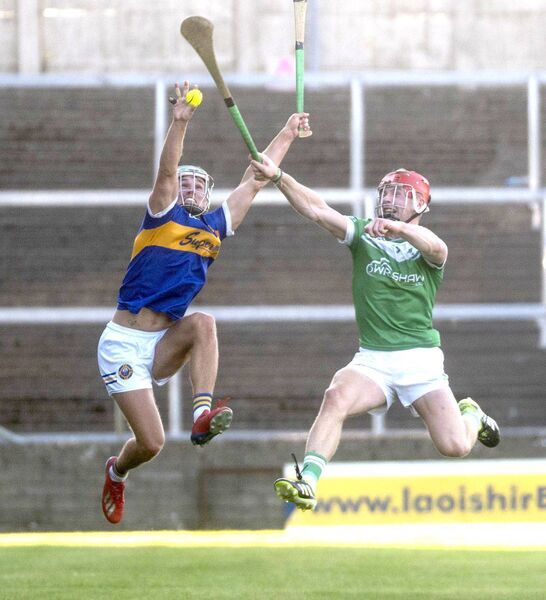 Jordan Walshe (Clough/Ballacolla) and Jimmy Hyland (Rosenallis) compete to win possession of the sliotar in Laois Hire O'Moore Park on Sunday Photo: Denis Byrne Jordan Walshe (Clough/Ballacolla) and Jimmy Hyland (Rosenallis) compete to win possession of the sliotar in Laois Hire O'Moore Park on Sunday Photo: Denis Byrne