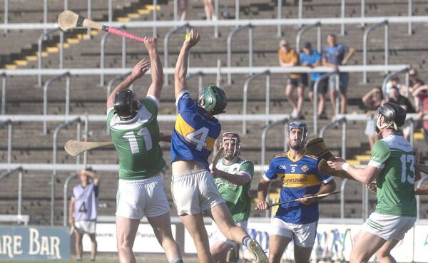 Cormac Hogan (Clough/Ballacolla) claiming this sliotar despite the pressure exerted by Rosenallis' Conor Cosgrove Photo: Denis Byrne Cormac Hogan (Clough/Ballacolla) claiming this sliotar despite the pressure exerted by Rosenallis' Conor Cosgrove Photo: Denis Byrne