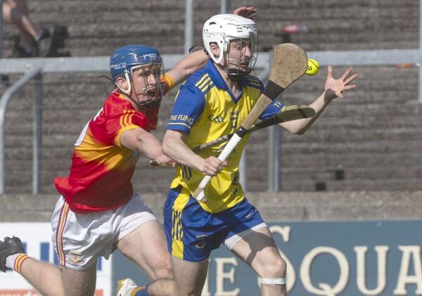 Sam Quinn (Abbeyleix) breaking with Jack Kennedy (Harps) challenging Photo: Denis Byrne Sam Quinn (Abbeyleix) breaking with Jack Kennedy (Harps) challenging Photo: Denis Byrne
