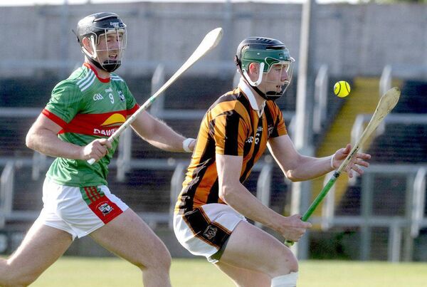 Cathal Cuddy (Camross) bringing this sliotar under control as Patrick Purcell (Rathdowney/Errill) closes in Photo: Denis Byrne Cathal Cuddy (Camross) bringing this sliotar under control as Patrick Purcell (Rathdowney/Errill) closes in Photo: Denis Byrne