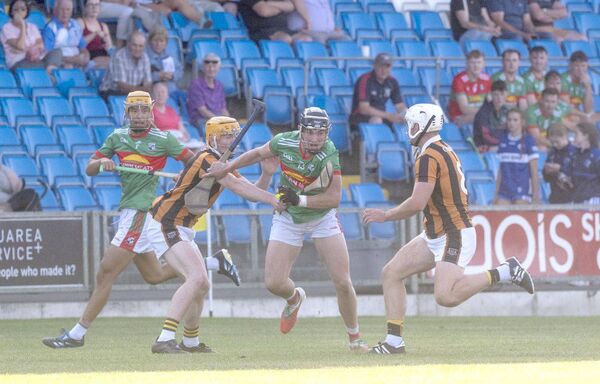 Michael Cleary (Rathdowney/Errill) in possession as Tom Cuddy (Camross) looks to dispossess him Photo: Denis Byrne Michael Cleary (Rathdowney/Errill) in possession as Tom Cuddy (Camross) looks to dispossess him Photo: Denis Byrne