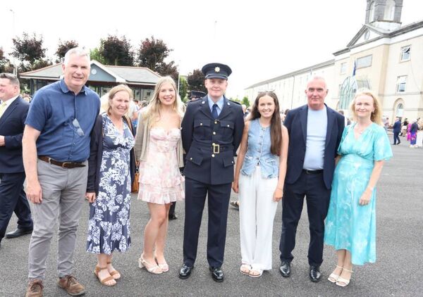Garda Darragh Cremins, whose girlfriend is from Laois, celebrating with the Cremins and Culbert families following his graduation. Photograph by James Treacy.