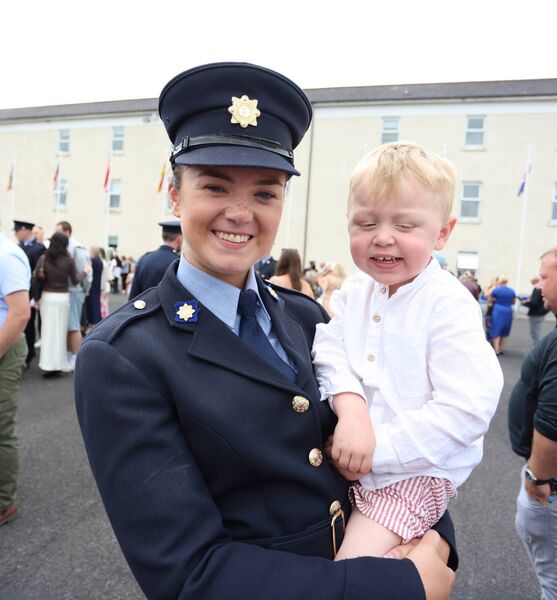 Garda Lisa Maher from Ennis with 3-year-old Paidi Keegan will be stationed in Portlaoise. Photograph by James Treacy.