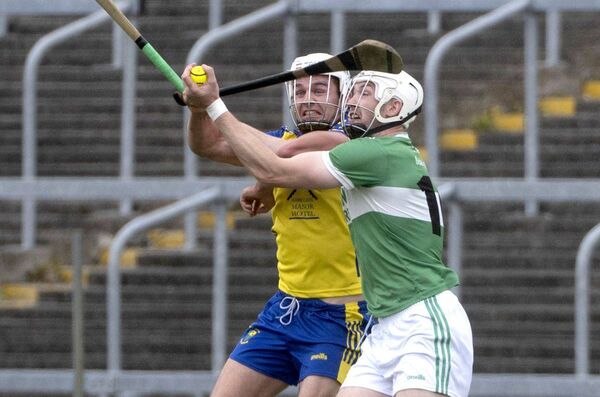 Liam Delaney (Abbeyleix) and Eanna Lyons (Ballyfin) compete for this sliotar Photo: Denis Byrne Liam Delaney (Abbeyleix) and Eanna Lyons (Ballyfin) compete for this sliotar Photo: Denis Byrne