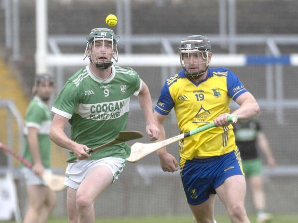 Ciaran Quinn (Ballyfin) gets to this ball ahead of Colm Walsh (Abbeyleix) Photo: Denis Byrne Ciaran Quinn (Ballyfin) gets to this ball ahead of Colm Walsh (Abbeyleix) Photo: Denis Byrne