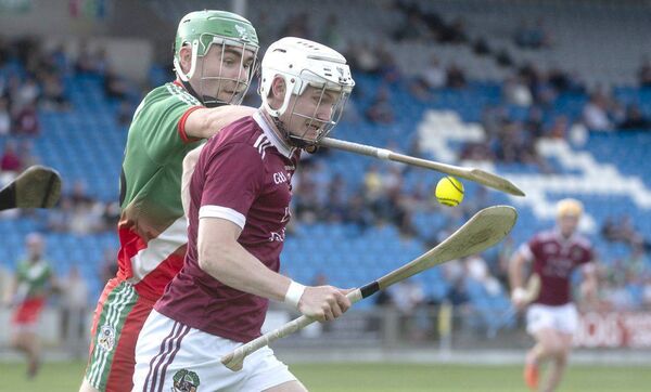 Cathal O'Shaughnessy (Ballinakill) looking to break as Dan Bergin (Borris/Kilcotton) moves to dispossess him Photo: Denis Byrne Cathal O'Shaughnessy (Ballinakill) looking to break as Dan Bergin (Borris/Kilcotton) moves to dispossess him Photo: Denis Byrne