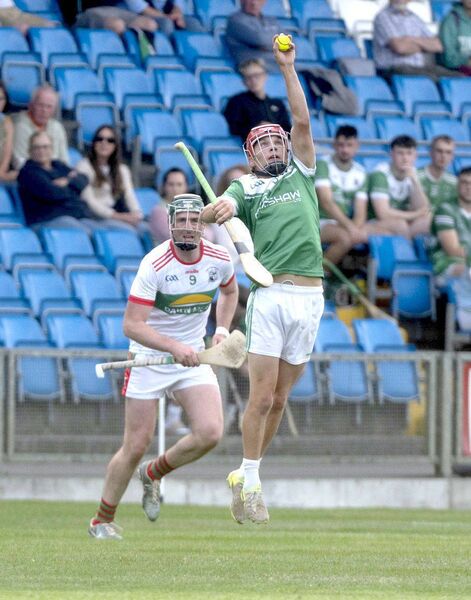 Alex Marron (Rosenallis) catching this sliotar against Rathdowney/Errill Photo: Denis Byrne Alex Marron (Rosenallis) catching this sliotar against Rathdowney/Errill Photo: Denis Byrne