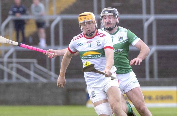 Mark Kavanagh (Rathdowney/Errill) breaking with Conor Cosgrove (Rosenallis) keeping close Photo: Denis Byrne Mark Kavanagh (Rathdowney/Errill) breaking with Conor Cosgrove (Rosenallis) keeping close Photo: Denis Byrne