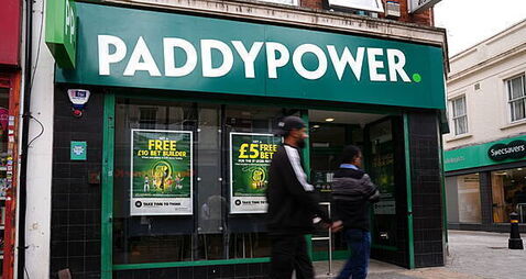 Boss of Paddy Power owner to step down after forecasts cut