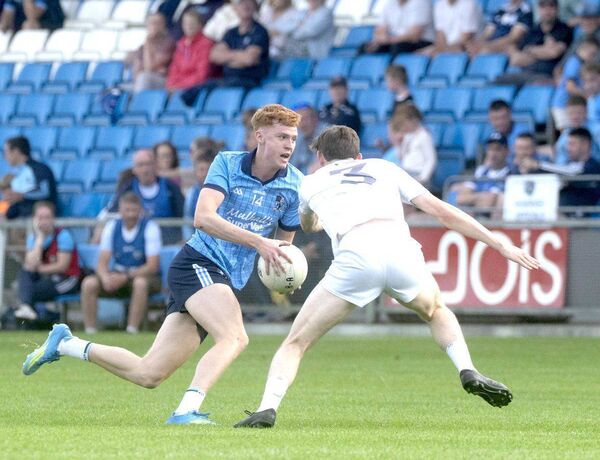 Killian Byrne (Ballyroan Abbey) looks for a way past Daniel Boland (Courtwood) on Saturday night 	 Photo: Denis Byrne