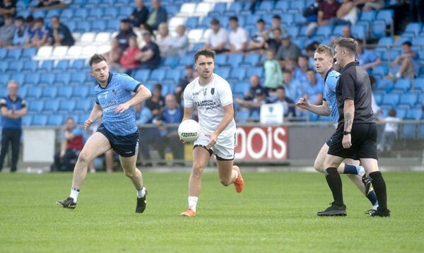 Alan Kinsella (Courtwood) in possession as Ballyraon Abbey's Diarmuid Whelan gives chase 	 Photo: Denis Byrne