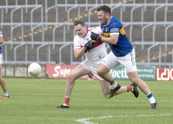 Eoin Montague (Emo) and Eoin Finlay (O'Dempsey's) tussle for this ball Photo: Denis Byrne Eoin Montague (Emo) and Eoin Finlay (O'Dempsey's) tussle for this ball Photo: Denis Byrne