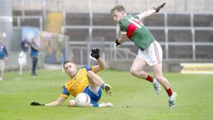 <p>Ciaran Condron (St. Joseph's) sliding towards this ball as Jack Byrne (Graiguecullen) runs to challenge Photo: Denis Byrne</p> <p>Ciaran Condron (St. Joseph's) sliding towards this ball as Jack Byrne (Graiguecullen) runs to challenge Photo: Denis Byrne</p>