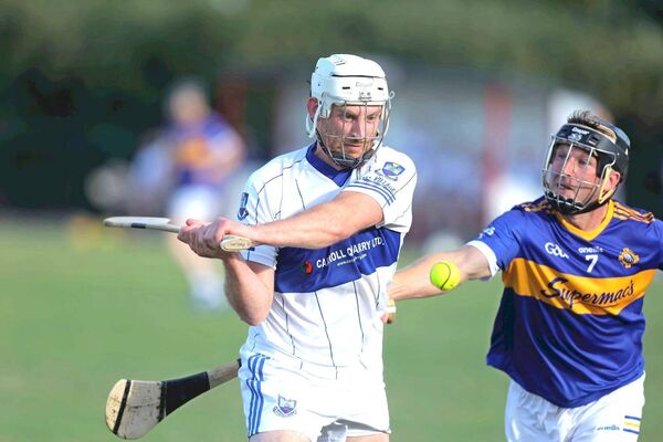 Castletown's Martin Phelan goes for goal as Canice Coonan (Clough/Ballacolla) attempts to hook during their PIHC Rd 3 game on Saturday Photo: David Maher Castletown's Martin Phelan goes for goal as Canice Coonan (Clough/Ballacolla) attempts to hook during their PIHC Rd 3 game on Saturday Photo: David Maher