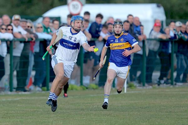 Castletown's Conor Phelan gathers the sliotar as CJ Brennan (Clough/Ballacolla) gives chase in their PIHC Rd 3 game Photo: David Maher Castletown's Conor Phelan gathers the sliotar as CJ Brennan (Clough/Ballacolla) gives chase in their PIHC Rd 3 game Photo: David Maher