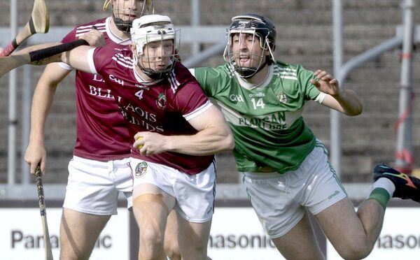 Lir McDonald (Ballinakill) looking to break as Shane Connolly (Ballyfin) challenges Photo: Denis Byrne Lir McDonald (Ballinakill) looking to break as Shane Connolly (Ballyfin) challenges Photo: Denis Byrne