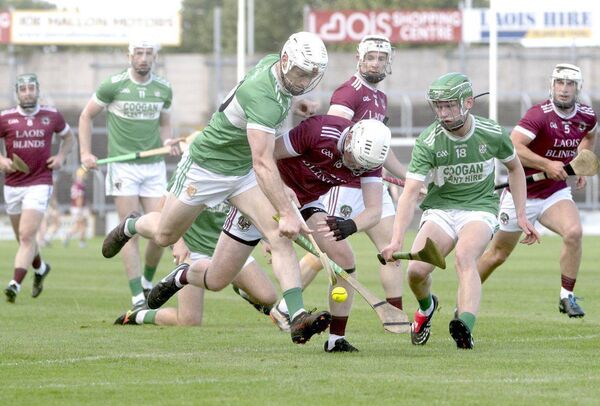 Louis Duff (Ballyfin) and Noel Duggan (Ballinakill) compete for this sliotar Photo: Denis Byrne Louis Duff (Ballyfin) and Noel Duggan (Ballinakill) compete for this sliotar Photo: Denis Byrne