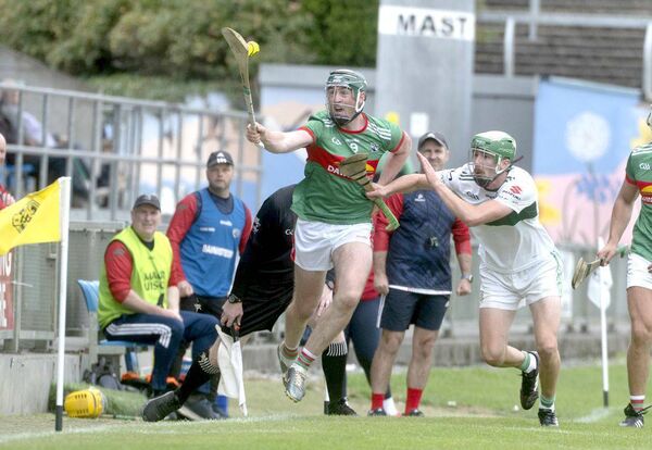 Patrick Purcell (Rathdowney/Errill) keeping this sliotar alive as Eoin O'Connor (Portlaoise) looks to get a challenge in during their SHC Rd 4 game on Sunday Photo: Denis Byrne Patrick Purcell (Rathdowney/Errill) keeping this sliotar alive as Eoin O'Connor (Portlaoise) looks to get a challenge in during their SHC Rd 4 game on Sunday Photo: Denis Byrne