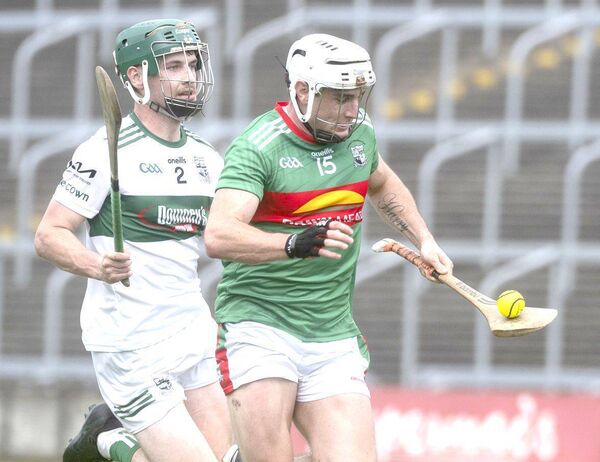 Ray Bowe (Rathdowney/Errill) breaking on goal with Conor Raggett (Portlaoise) giving chase Photo: Denis Byrne Ray Bowe (Rathdowney/Errill) breaking on goal with Conor Raggett (Portlaoise) giving chase Photo: Denis Byrne
