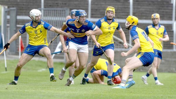 Brian Corby (Clough/Ballacolla) looks to shake off these Abbeyleix players in their SHC Rd 4 game Photo: Denis Byrne Brian Corby (Clough/Ballacolla) looks to shake off these Abbeyleix players in their SHC Rd 4 game Photo: Denis Byrne