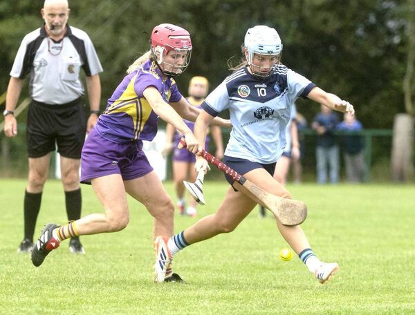 The races is on s Amy McKane (O'Moore's) and Sarah Creagh (St. Brigid's) chase possession of the sliotar in their Intermediate Championship Rd 1 game Photo: Denis Byrne The races is on s Amy McKane (O'Moore's) and Sarah Creagh (St. Brigid's) chase possession of the sliotar in their Intermediate Championship Rd 1 game Photo: Denis Byrne