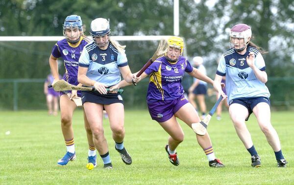 Jenny McEvoy (O'Moore's) and Niamh Sweeney (St Brigid's) compete for this sliotar Photo: Denis Byrne Jenny McEvoy (O'Moore's) and Niamh Sweeney (St Brigid's) compete for this sliotar Photo: Denis Byrne