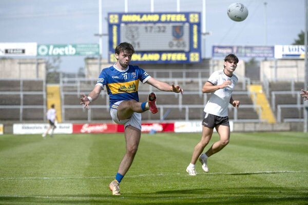 Jack Lennon (O'Dempsey's) playing for a score against Arles Killeen 	 Photo: Denis Byrne