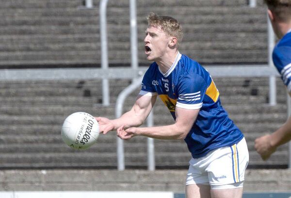 Barry Kelly (O'Dempsey's) lays off this ball in the win over Arles Killeen 	 Photo: Denis Byrne