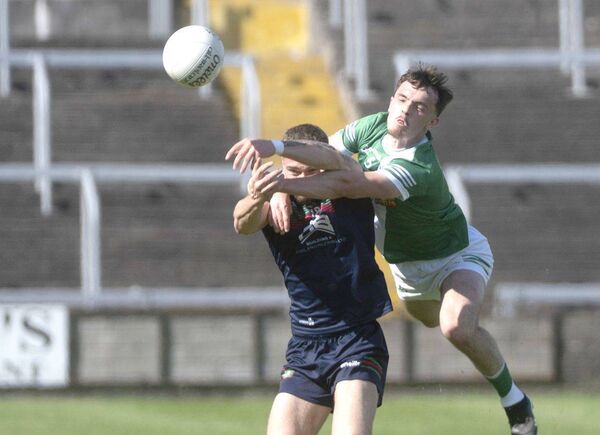 Killeshin's Michael Gaffney gets in over Graiguecullen's Aaron Dorgan to punch this ball away Photo: Denis Byrne Killeshin's Michael Gaffney gets in over Graiguecullen's Aaron Dorgan to punch this ball away Photo: Denis Byrne