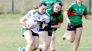 <p>Portlaoise's Grainne Moran drives at the heart of the Graiguecullen defence 	 Photo: David Maher</p>