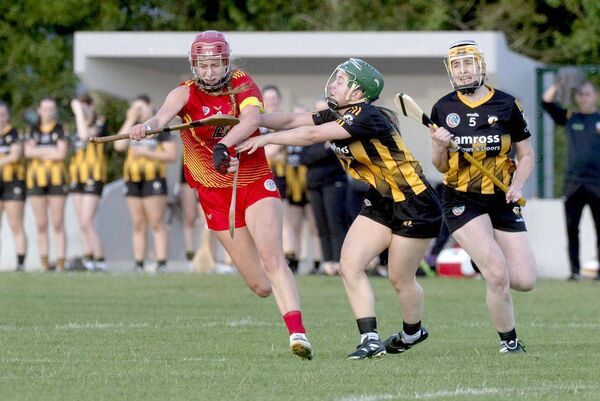 Rachel Deegan (Harps) is determined to make it past Donnagh Mortimer (Camross) Photo: Denis Byrne Rachel Deegan (Harps) is determined to make it past Donnagh Mortimer (Camross) Photo: Denis Byrne