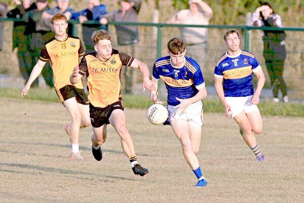 O'Dempsey's Dylan Quick races away from The Heath's Kieran Killeen in the Junior Football Championship game on Wednesday Photo: David Maher O'Dempsey's Dylan Quick races away from The Heath's Kieran Killeen in the Junior Football Championship game on Wednesday Photo: David Maher